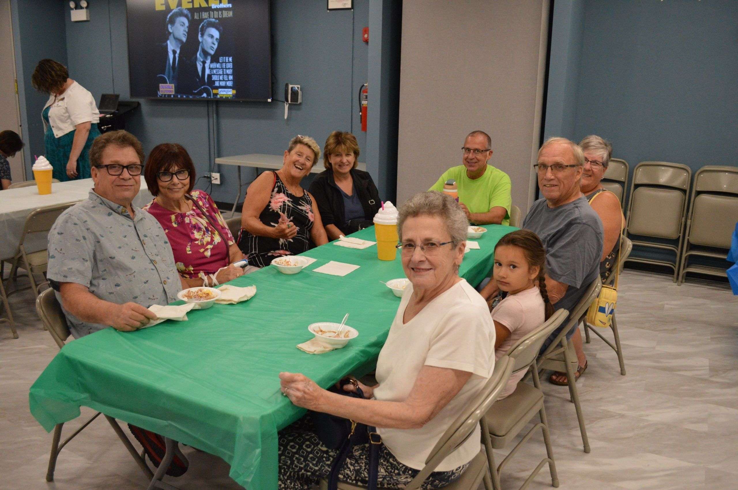 group picture of a family at a table during the ice cream social