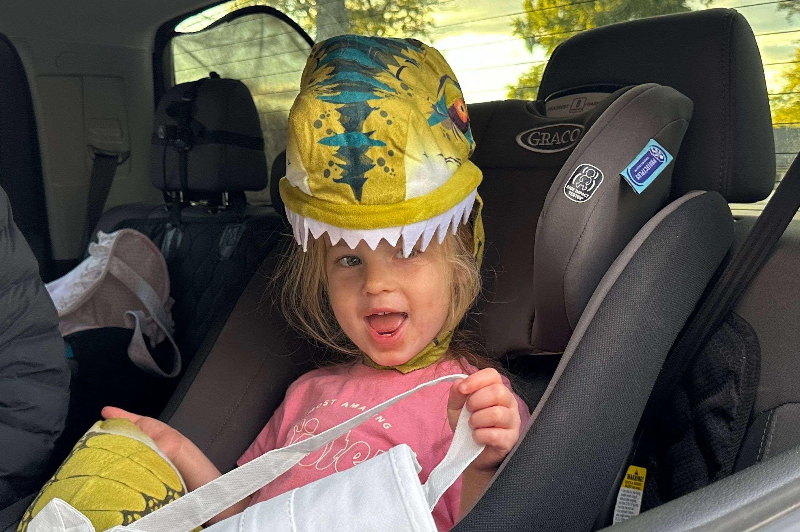 young girl dressed as a dinosaur at Trunk or Treat